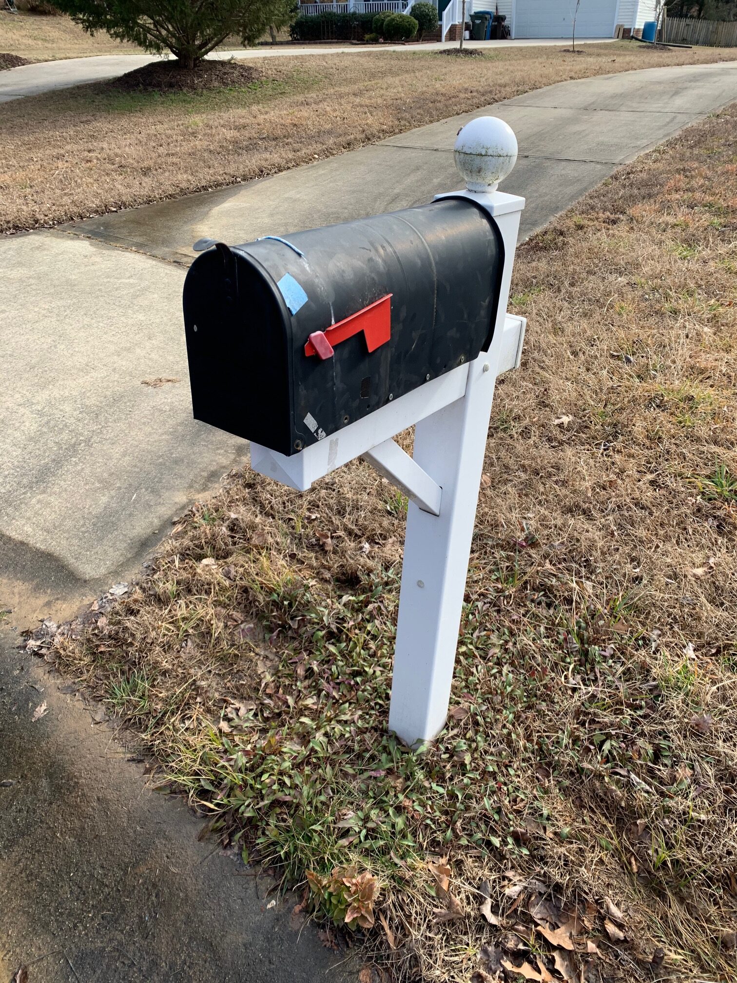 Repaired mailbox secured with screws by Bull City Handyman