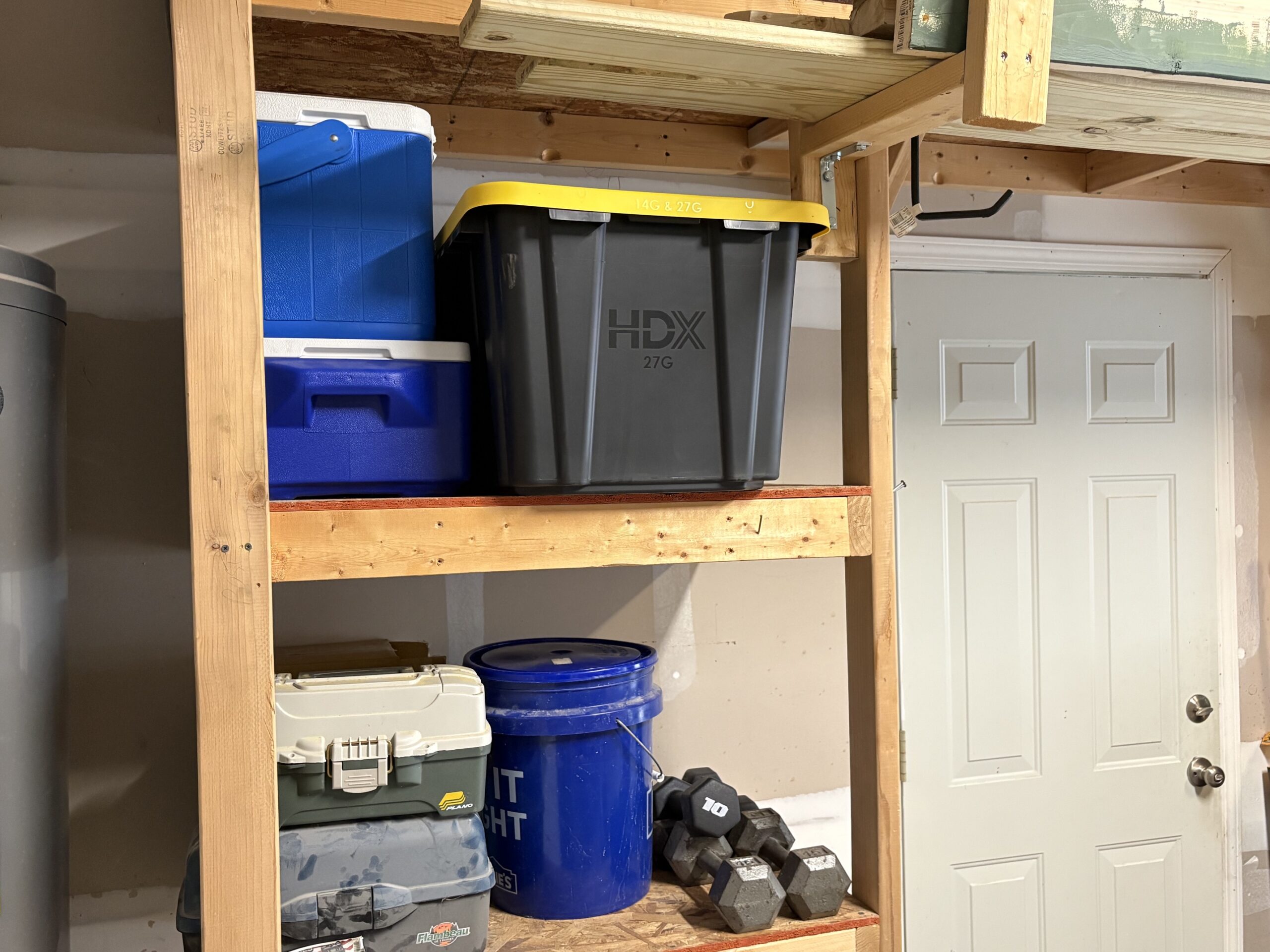 Custom wood wall-mounted garage shelving installed - Bull City Handyman Durham NC